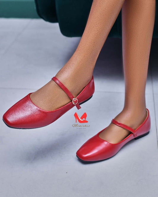 Ballerina maroon shoes featuring a stylish strap and flat design, perfect for elegant casual wear.