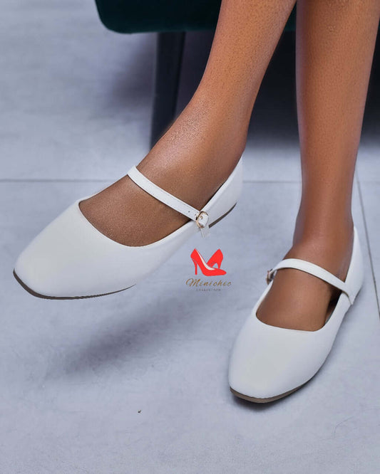 Stylish Ballerina White flats featuring a classic design and ankle strap, perfect for chic casual outfits.